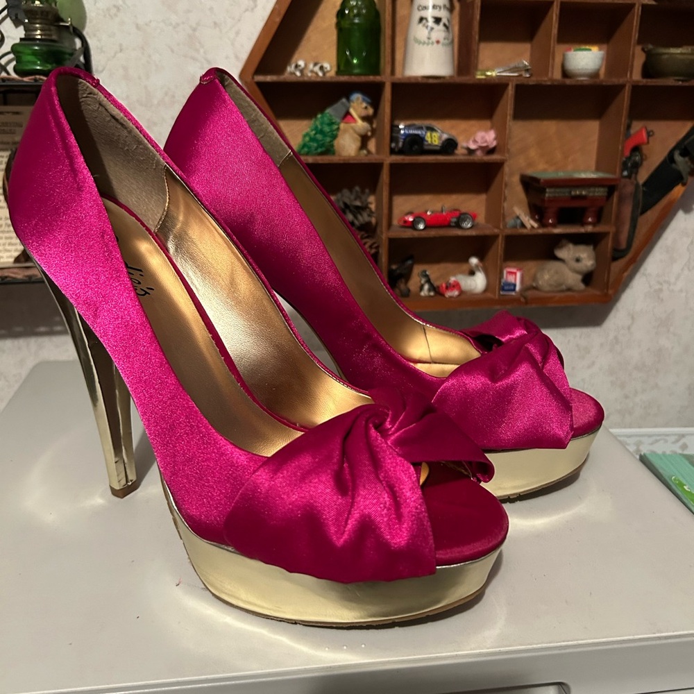 Very pink 6” heels on slightly golden heels and platform